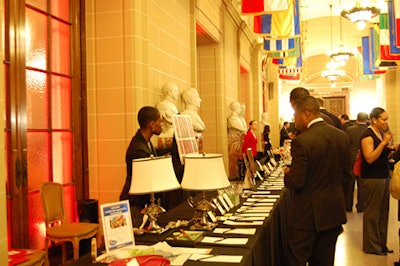 The windows behind the silent auction area glowed red, thanks to the uplit ballroom.