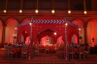 Bows, embroidered stars, and metal lanterns outfitted the Arabian-style tents.