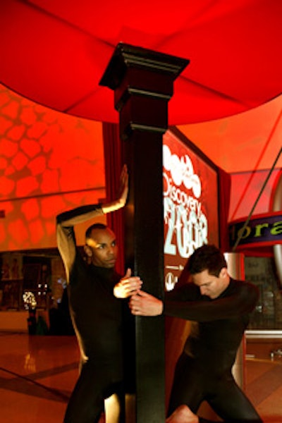 Black-clad performers undulated at the entrance to the dinner space.