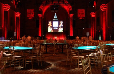 Washed in red lighting, the floor of the venue was packed with dining and poker tables.