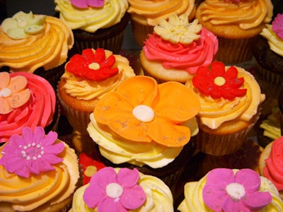 Flowers decorate cupcakes from the Cupcakery.