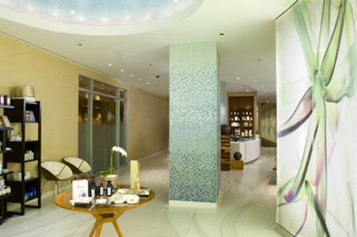 The entrance includes a retail center and reception desk.
