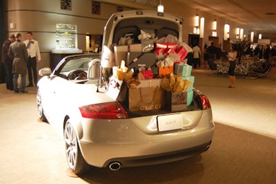 Event sponsor Audi showcased an automobile filled with parcels from Gucci, Prada, Ports, and Holt Renfrew at the cocktail reception.