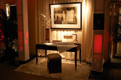 A display featuring a wooden desk topped with architectural drawings and sketches paid tribute of interior designer Brian Gluckstein.