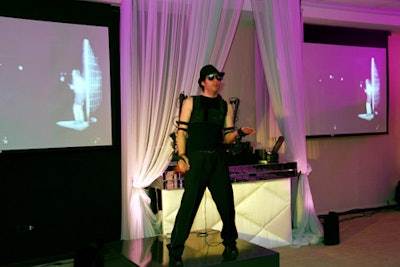 A percussionist equipped with a MIDI (that's a musical instrument digital interface) suit entertained along with the DJ.