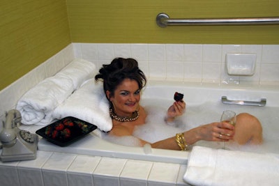 A (seemingly naked) model showed off the presidential suite's bathtub.