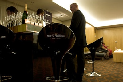 A Moët & Chandon lounge, complete with a branded bar and sleek, swiveling stools, stood outside the James Hotel's great room east, where John Legend performed.