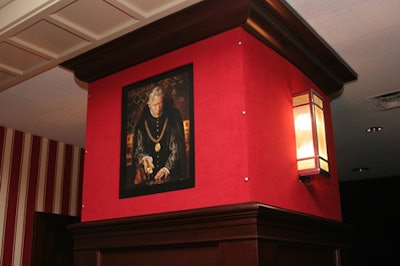 Images of the cast (made to look like old-time portraits) hung against red velvet wallpaper.