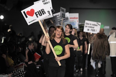 Models carrying placards—with slogans like 'I love fur'—staged a pro-fur protest at the Beautifully Canadian show.