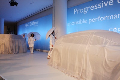 The car reveal and fashion show took place in front of a large video wall on the west side of the building's lobby.