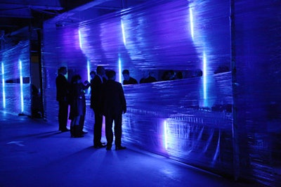 A plastic-wrap wall formed the front of the bar area, with only a narrow, horizontal strip of space through which the bartenders could communicate and pass drinks.
