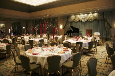 In the ballroom of the Ritz-Carlton, guests had dinner at tables that Kehoe Designs had decorated with flowering branches of cascading orchids.