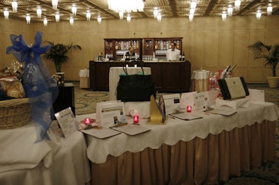 In a room just off the ballroom, silent-auction tables offered items ranging from a Fendi evening bag to a leash-and-bone-stuffed gift basket from Lincoln Park Dog and Cat Clinic.