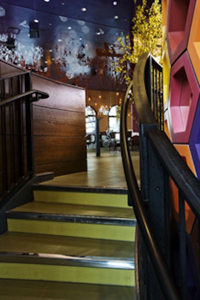 A staircase leads from the lower-level lounge to the main dining room.