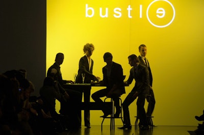 Bustle's show took on a casino theme, with dollar bills scattered along the runway and models playing a hand of baccarat prior to walking the catwalk.