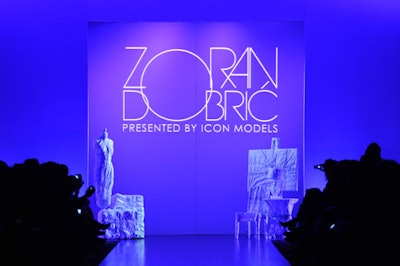 Furniture wrapped in white cloth and tied with rope sat at the entrance to the runway during Zoran Dobric's show.
