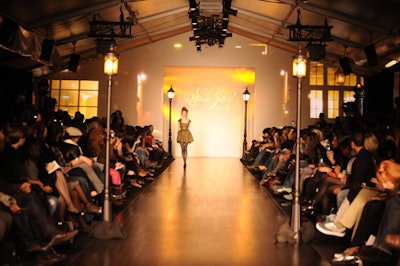 Nada Yousif created a Paris street scene for the presentation of her collection.