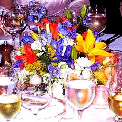 In order to keep as much of the money raised by the event as possible, the decor was limited to simple, colorful bouquet centerpieces by Sung Jung of Doro's Annex.