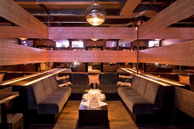 The Vault, a former bank vault, is a private room with mirrored walls and plush seating.