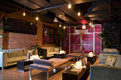 The Loft features exposed-brick walls, couches and chaise lounges, and hanging lights.