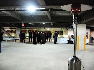 Heat lamps helped keep guests warm in the garage space.