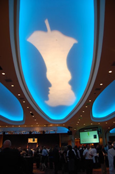 Share Our Strength's brand-new corporate logo illuminated the ballroom ceiling.