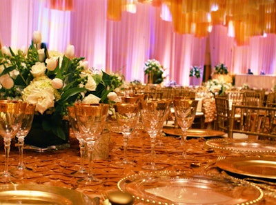 Everything from the metallic Chiavari chairs to the gilded glassware appeared in shades of gold and champagne.