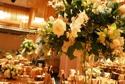 Each table featured an oversize centerpiece created by Botanica, which towered above the place settings.