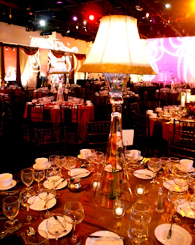 Each table featured a clear glass lamp, which illuminated the place settings.