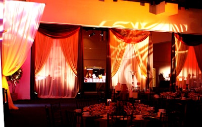 The large ballroom was strategically draped in segments to evoke the curtains of a parlor window.