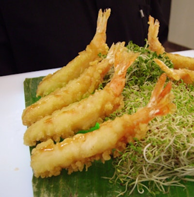 Cater waiters served shrimp tempura with a honey ginger sauce from glowing acrylic trays.