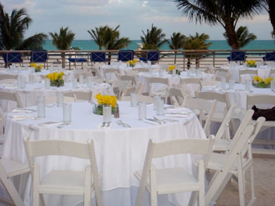 For the athletes' dinner at the Ritz, white tables draped in white linens were topped with blossoming yellow calla lily centerpieces.