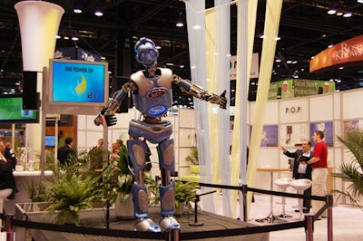An interactive robot at the idX Green Product Challenge Showcase garnered a mob scene as it talked with passersby.