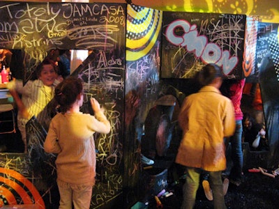 In keeping with the awards' logo, intended to inspire kids' creativity, kids left messages on a chalkboard wall.