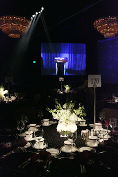 Dark hues covered the ballroom, which featured black tablecloths and dark lighting.