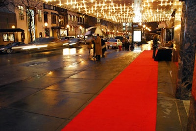 Due to the early-spring rain and sleet, Event Creative placed the red carpet under the theater's awning and hired umbrella-bearing escorts to lead guests to Dismero.
