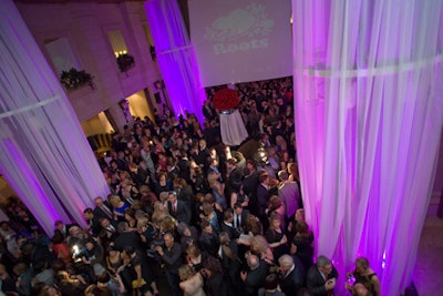 Coloured lighting—including projections of sponsors' logos—set the mood in the Windsor Arms' Courtyard Cafe at Chatelaine's 80th anniversary celebration.