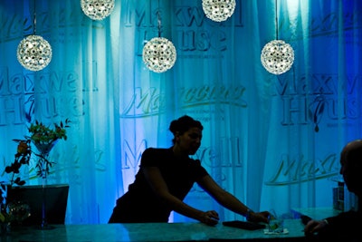 Hanging lights, sheer drapes, and the Maxwell House logo created an intimate coffee lounge promoting Maxiccino, the company's new instant-cappuccino product.