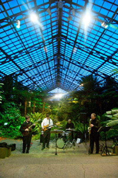 Local band the J3 Intent played from a grotto with a waterfall backdrop.
