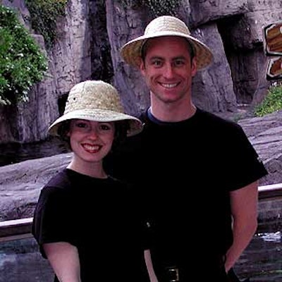 Wait staff in safari hats served a variety of foods amidst colorful arrangements of plastic animals, greenery and rustic signage by Match Catering and Eventstyles and Musters & Company.