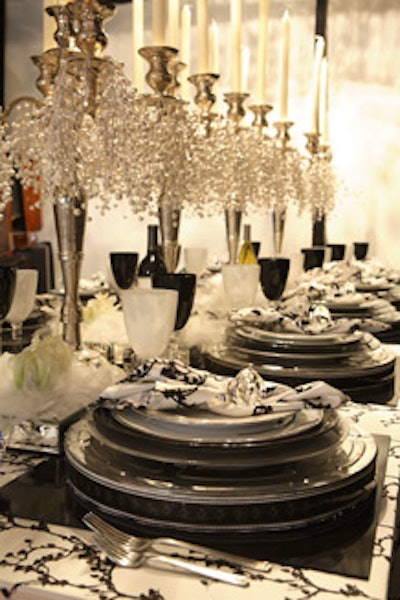 Cathy Hobbs of boutique and interior design firm Aphereä used film reels and canisters as a fanciful base for china.