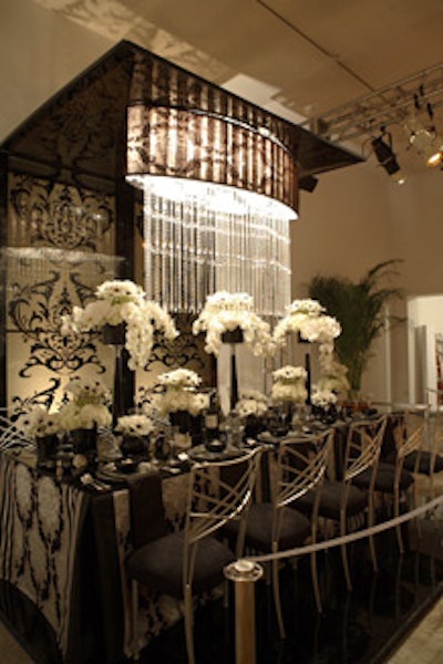 Jerry Sibal's black-and-white table for Design Fusion included a fabric-covered shade trimmed with long strands of crystals.