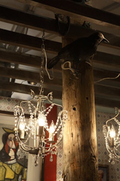 Gary Bias's kitschy setting (dubbed 'Queen Acres') for EventCo Productions included two miniature vintage-looking chandeliers hung on either side of a telephone pole.