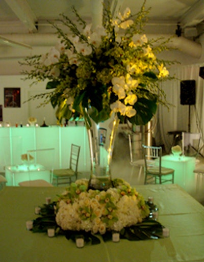 Topping the largest table in the winter room was a towering arrangement of lighted white flowers created by Pistils and Petals.