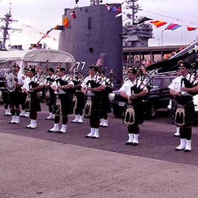 An honor guard played for entering guests at the USS Intrepid Sea Air Space Museum's Fleet Week gala.