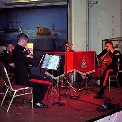 In the huge dining room area, a naval band played for guests during dinner.