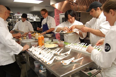 Big-name chefs like Tom Colicchio (left) and their crews set up their dishes in Espace's kitchen. Despite the number of plates being set up at once, the kitchen was surprisingly calm and tidy.