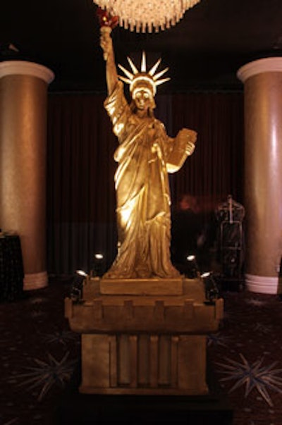 A golden-hued Statue of Liberty sat in the silent auction area.