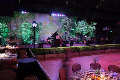 Trees, a park bench, and a 13-foot tall clock decorated the stage.