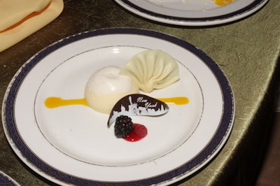 The New York skyline appeared on a sliver of chocolate that garnished the cheescake dessert.